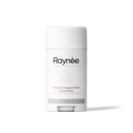 White deodorant container with twist mechanism on the bottom. Product name Raynèe. Labeled peptide peppermint deodorant